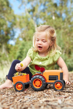 Load image into Gallery viewer, girl playing with orange tractor