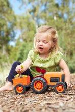 Load image into Gallery viewer, girl playing with orange tractor
