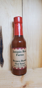 glass bottle of Bronco Bustin Hot sauce