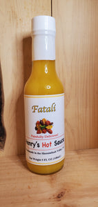5 oz glass bottle of fatali hot sauce which is yellow