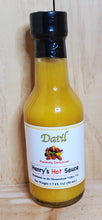 Load image into Gallery viewer, small glass bottle of yellow datil hot sauce
