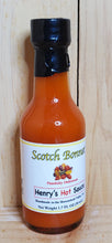 Load image into Gallery viewer, small glass bottle with red scotch bonnet hot sauce

