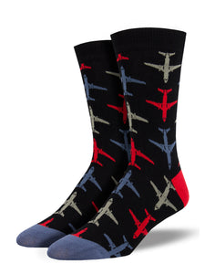 red blue and gray jets atop a black background of socks with a red heel